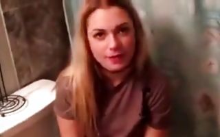 Lovely blonde with big tits sucks nicely on her knees